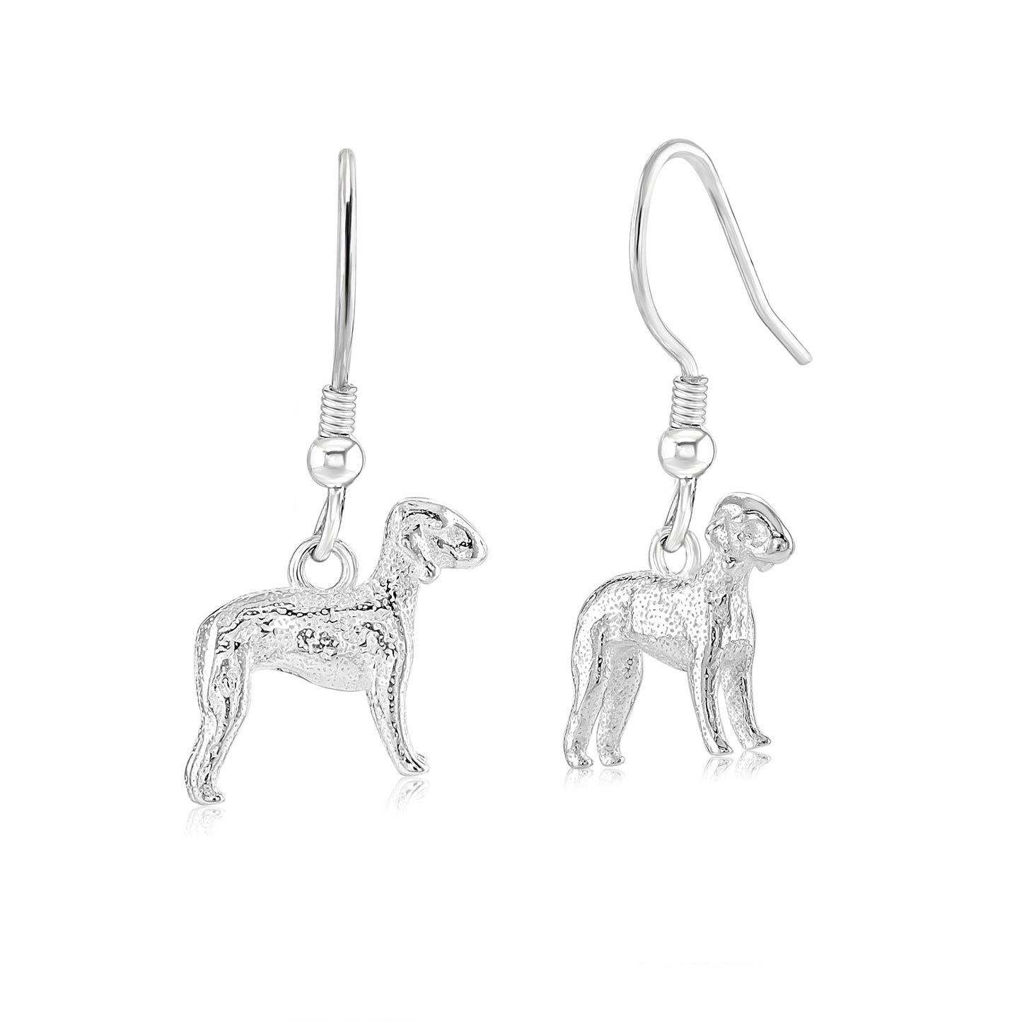 A pair of sterling silver earrings in the shape of Bedlington Terrier dogs.